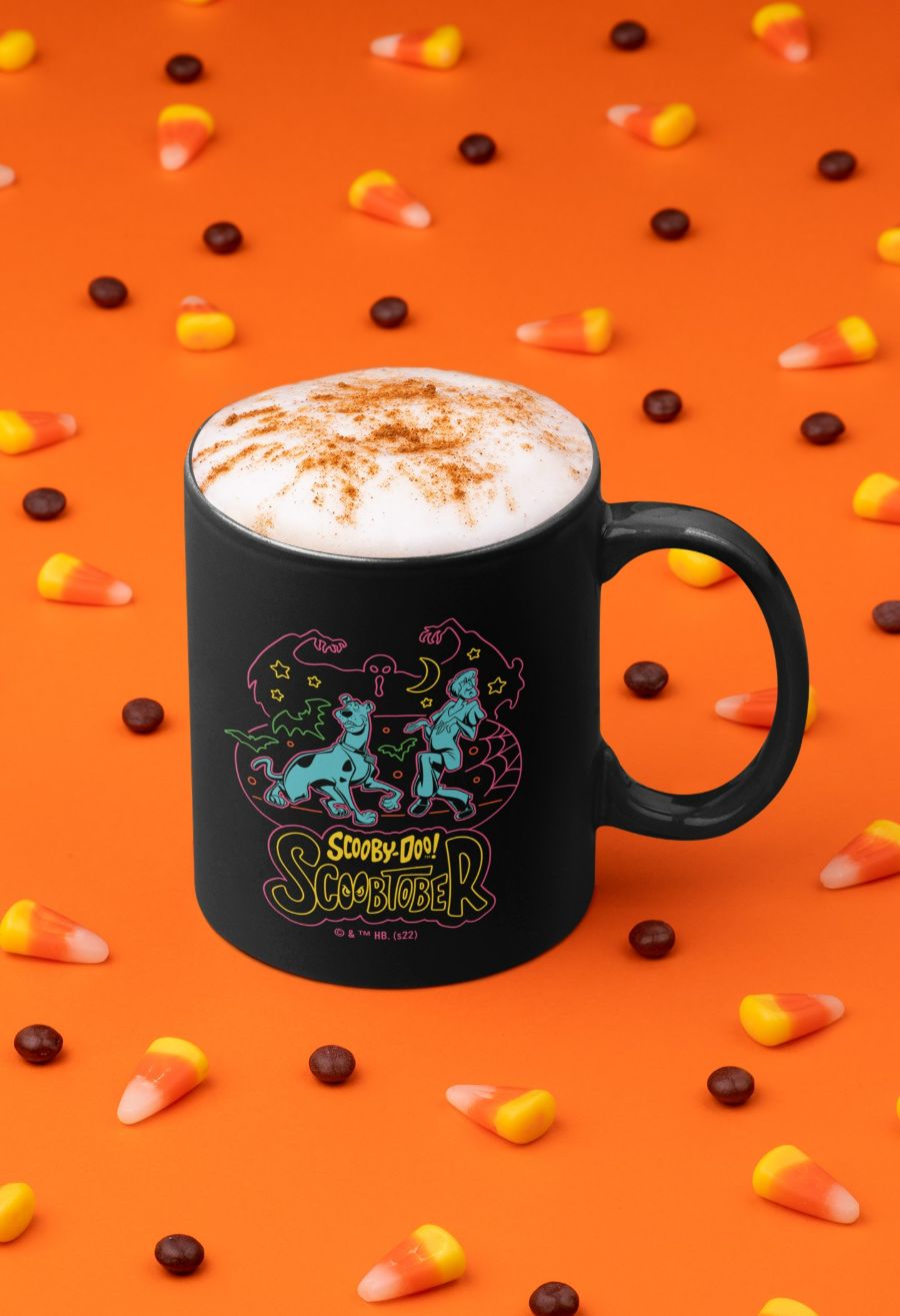 SD-Scoobtober_11-oz-coffee-mug-mockup-surrounded-by-halloween-candies-29148